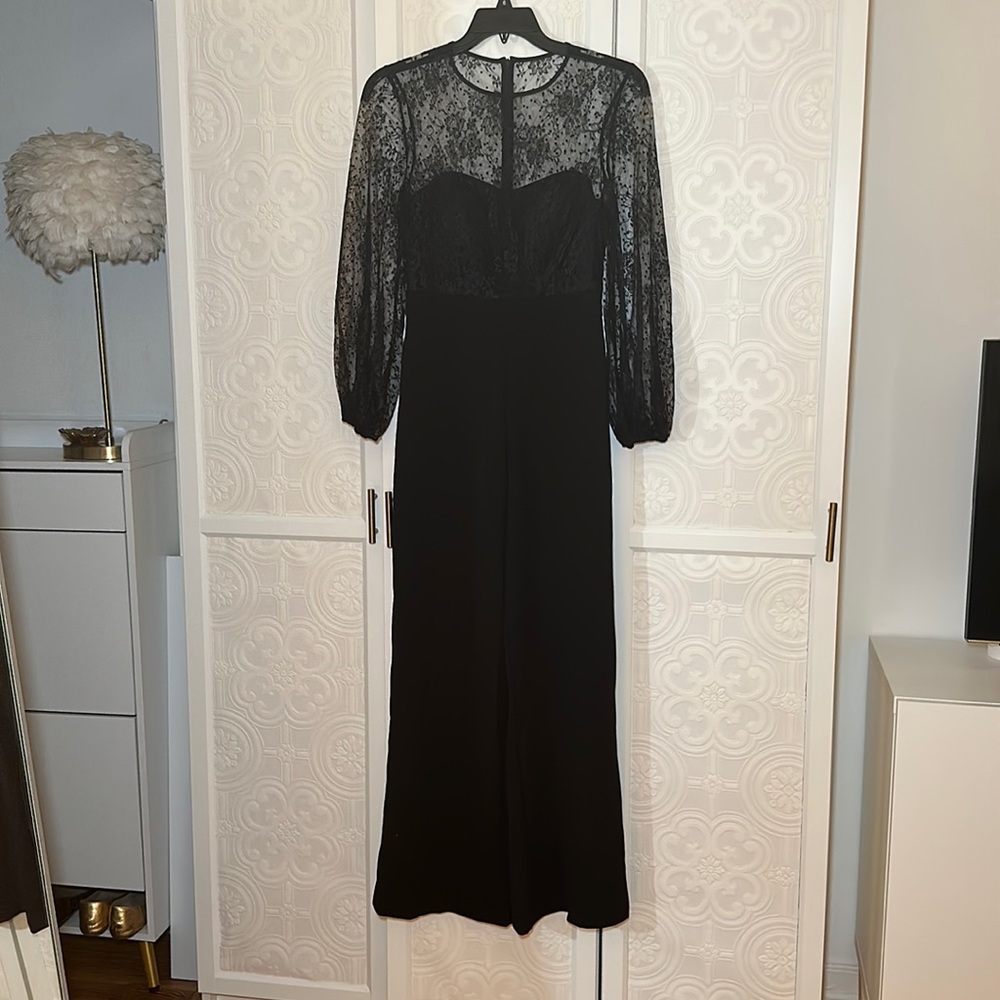 Eliza J flocked lace and crepe long sleeve jumpsuit. Sheer sleeves and yoke